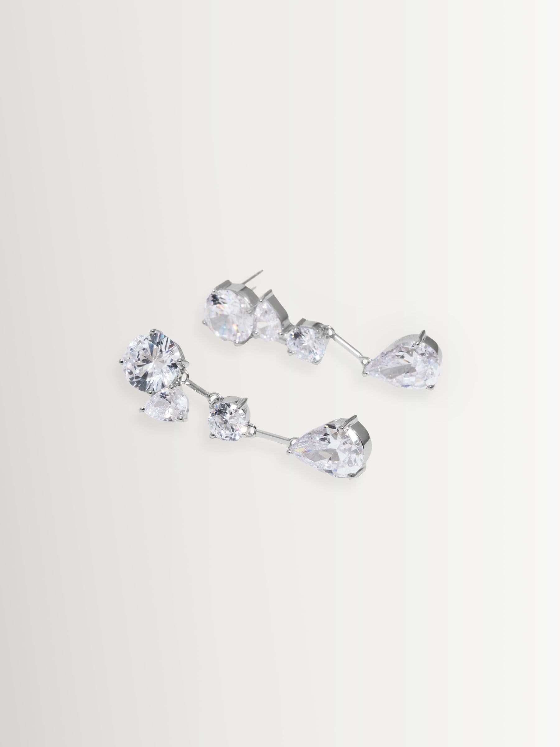 Completedworks rhodium earrings with cubic zirconia (British brand)