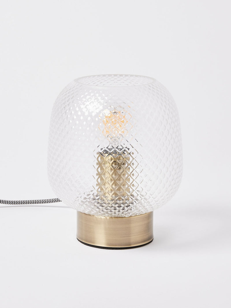 Oliver Bonas table lantern with textured glass shade and brass base, imported from the UK