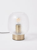 Oliver Bonas table lantern with textured glass shade and brass base, imported from the UK
