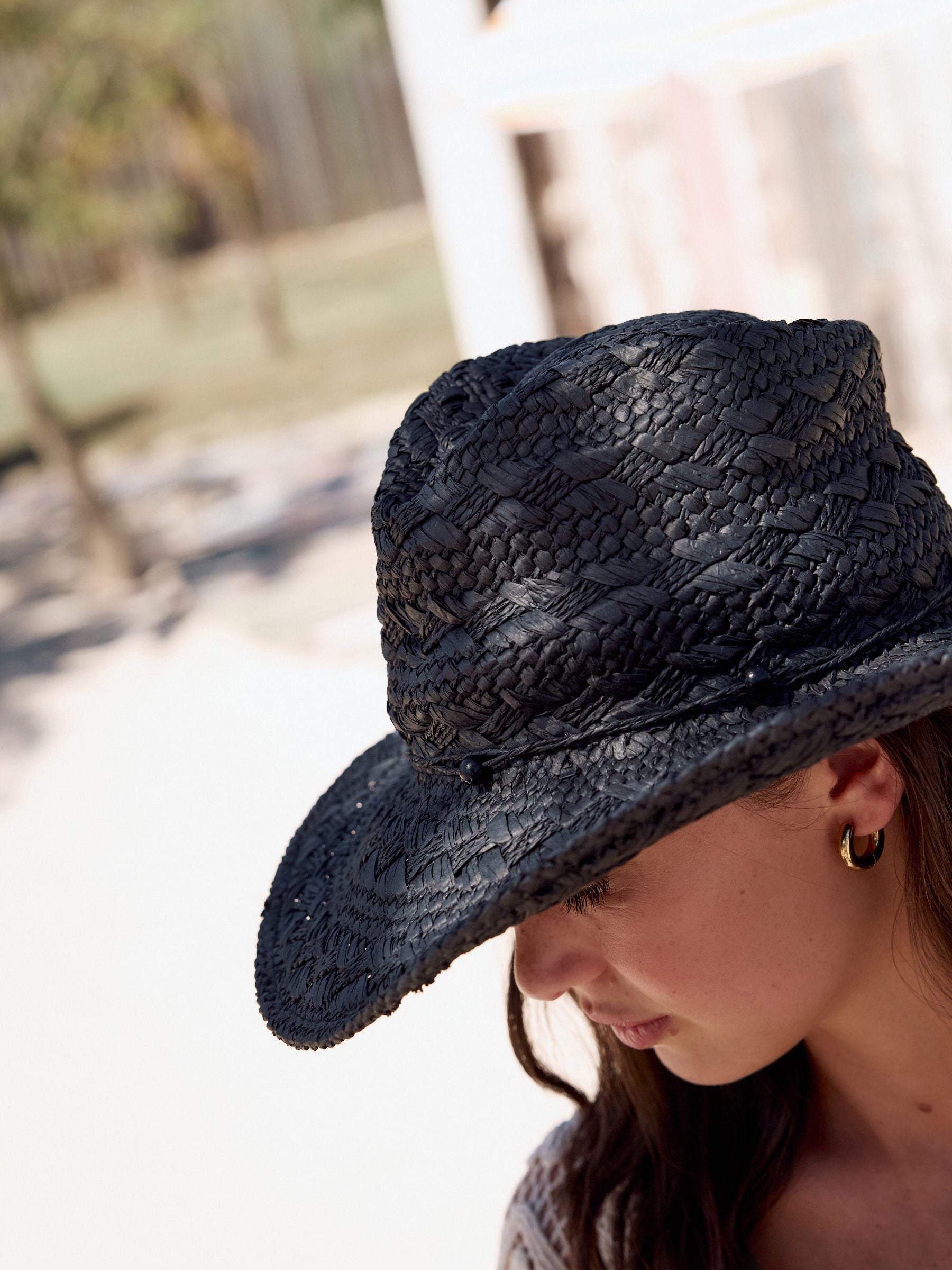 Black western straw-look hat with beaded trim and wide brim - British product