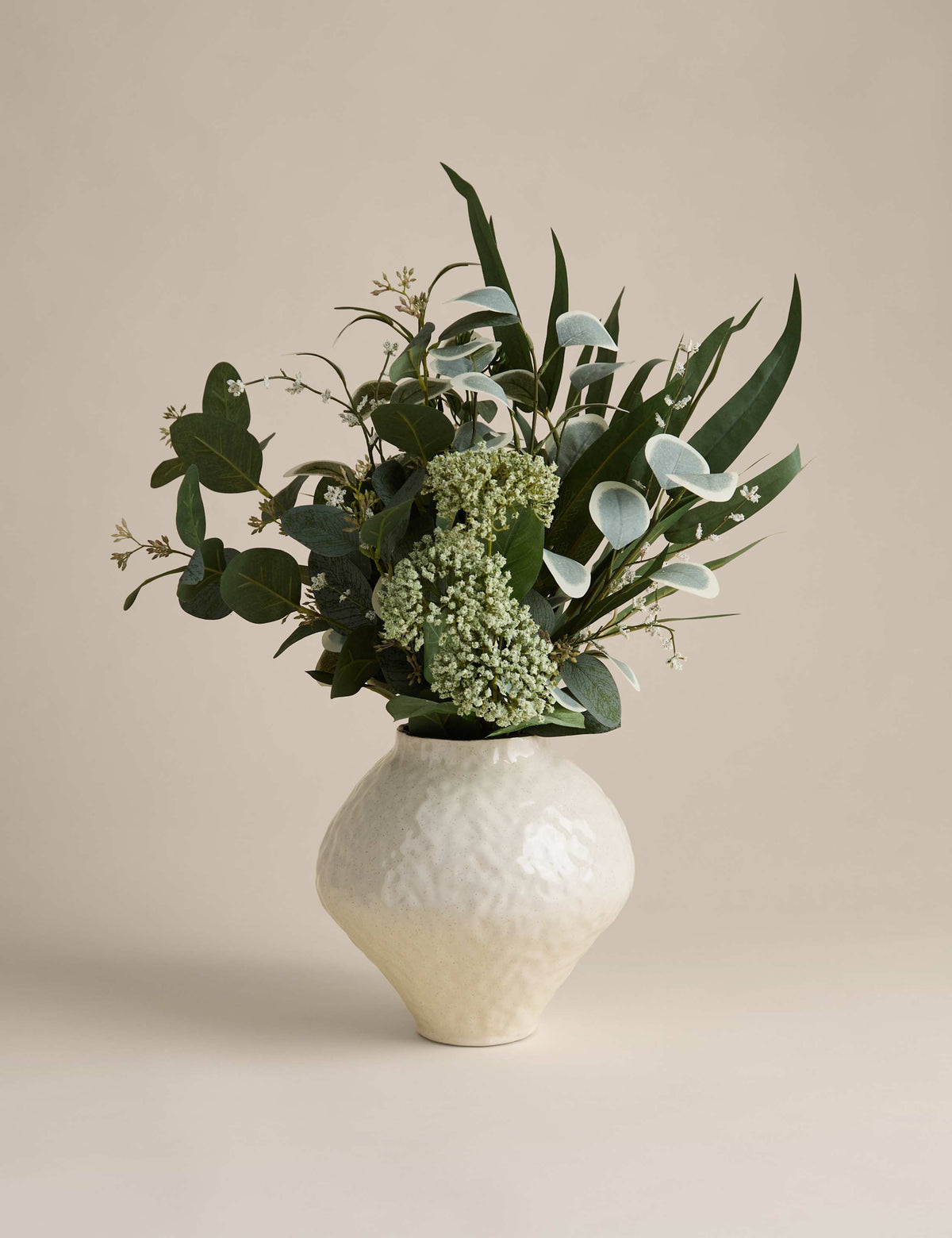 Large artificial eucalyptus arrangement in a ceramic vase, imported from the UK