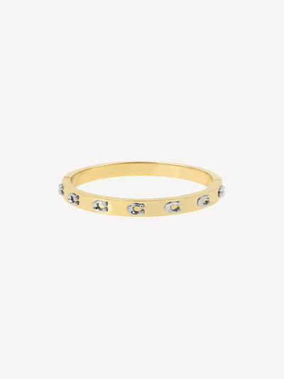 Next Hengslet messing armbånd med signaturmotiver og pose - Kjøp online på McGrocer