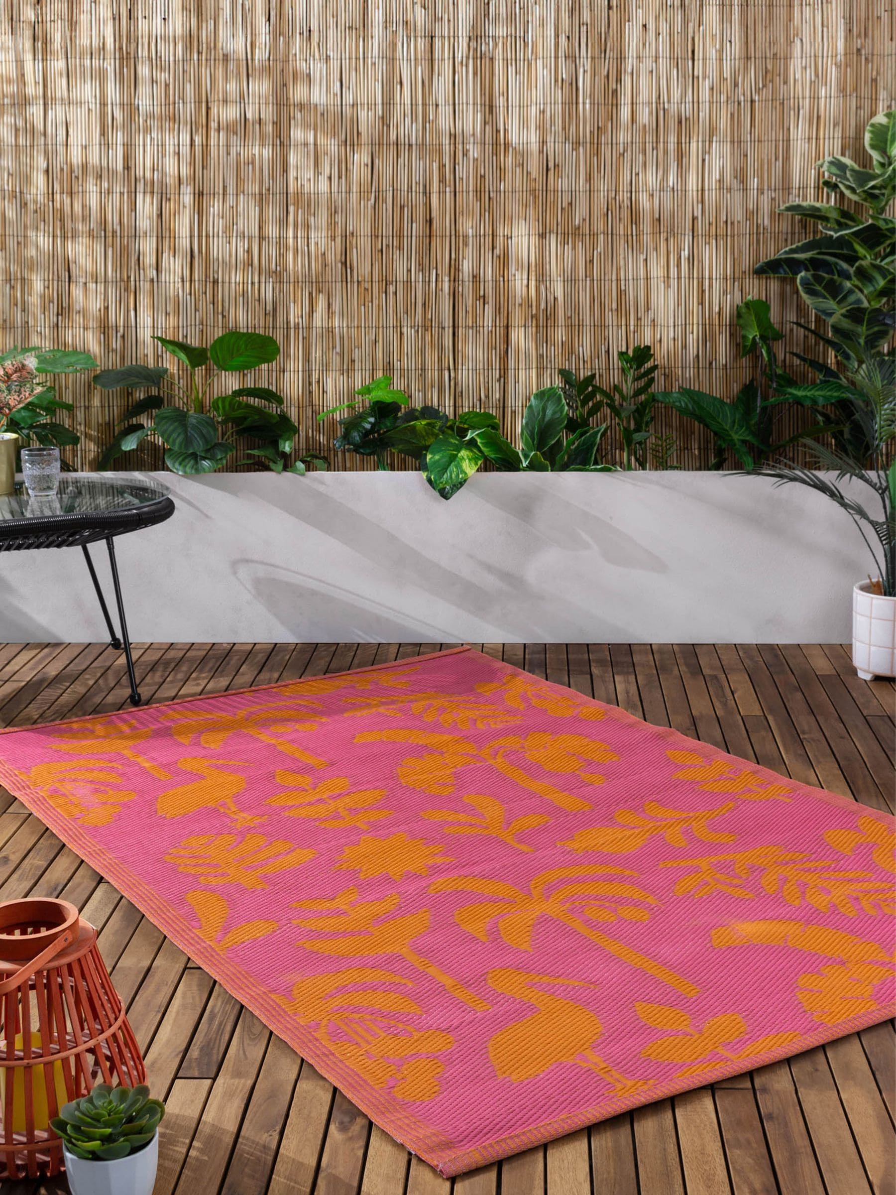 Furn Marula tropical outdoor rug in orange pink, UK version