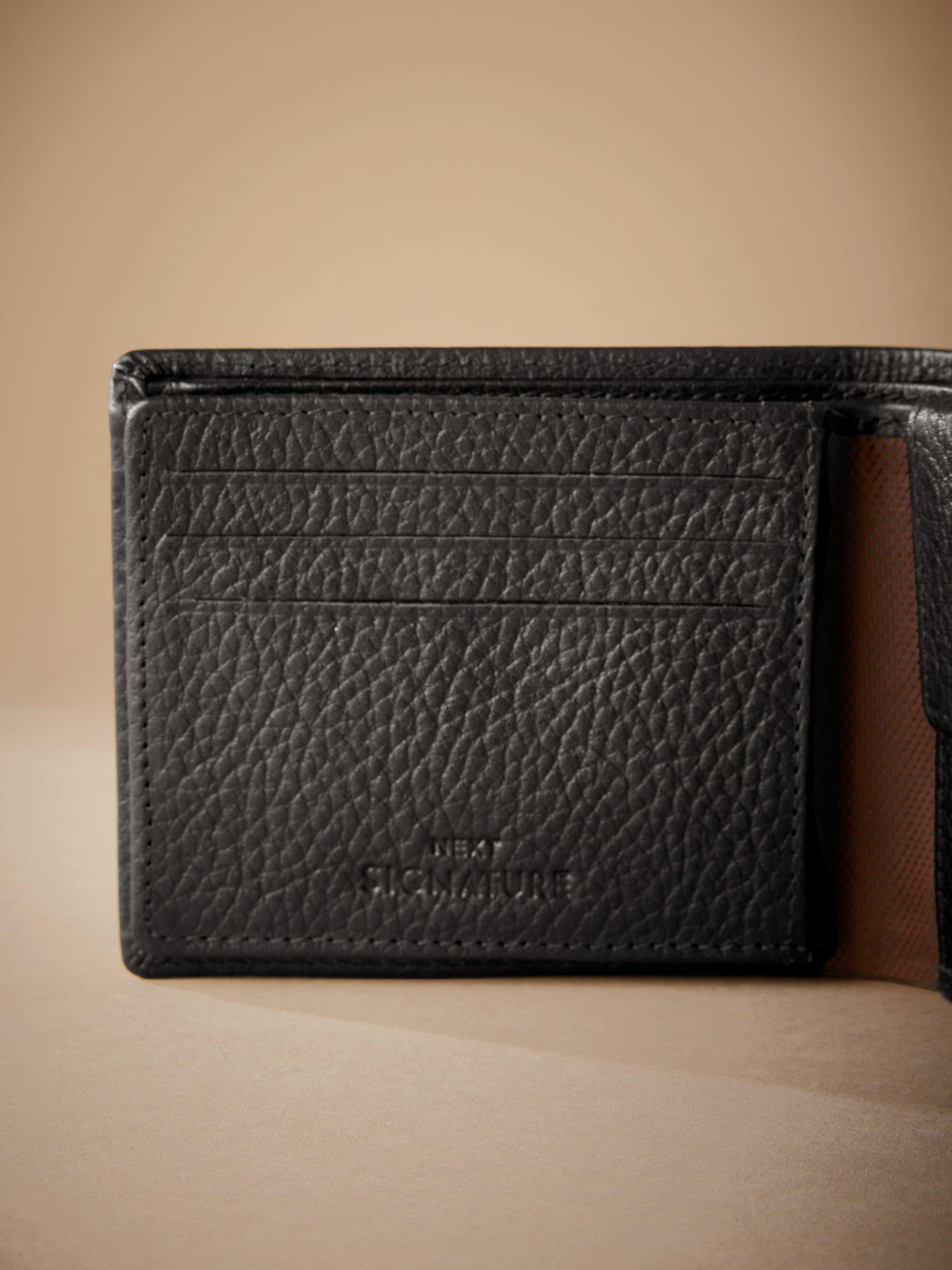 Black Signature Monogram leather wallet from British brand