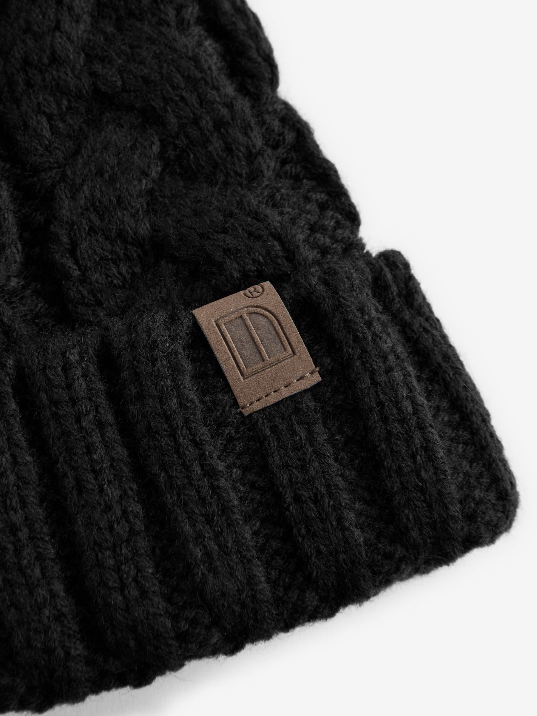 Cable knit pom hat black for children aged 1-16, imported from the UK