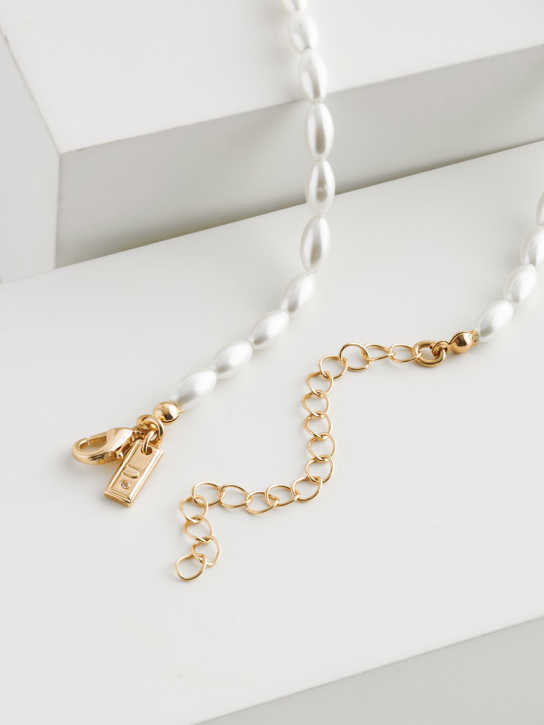 White glass pearl short necklace with gold-tone clasp, imported from the UK