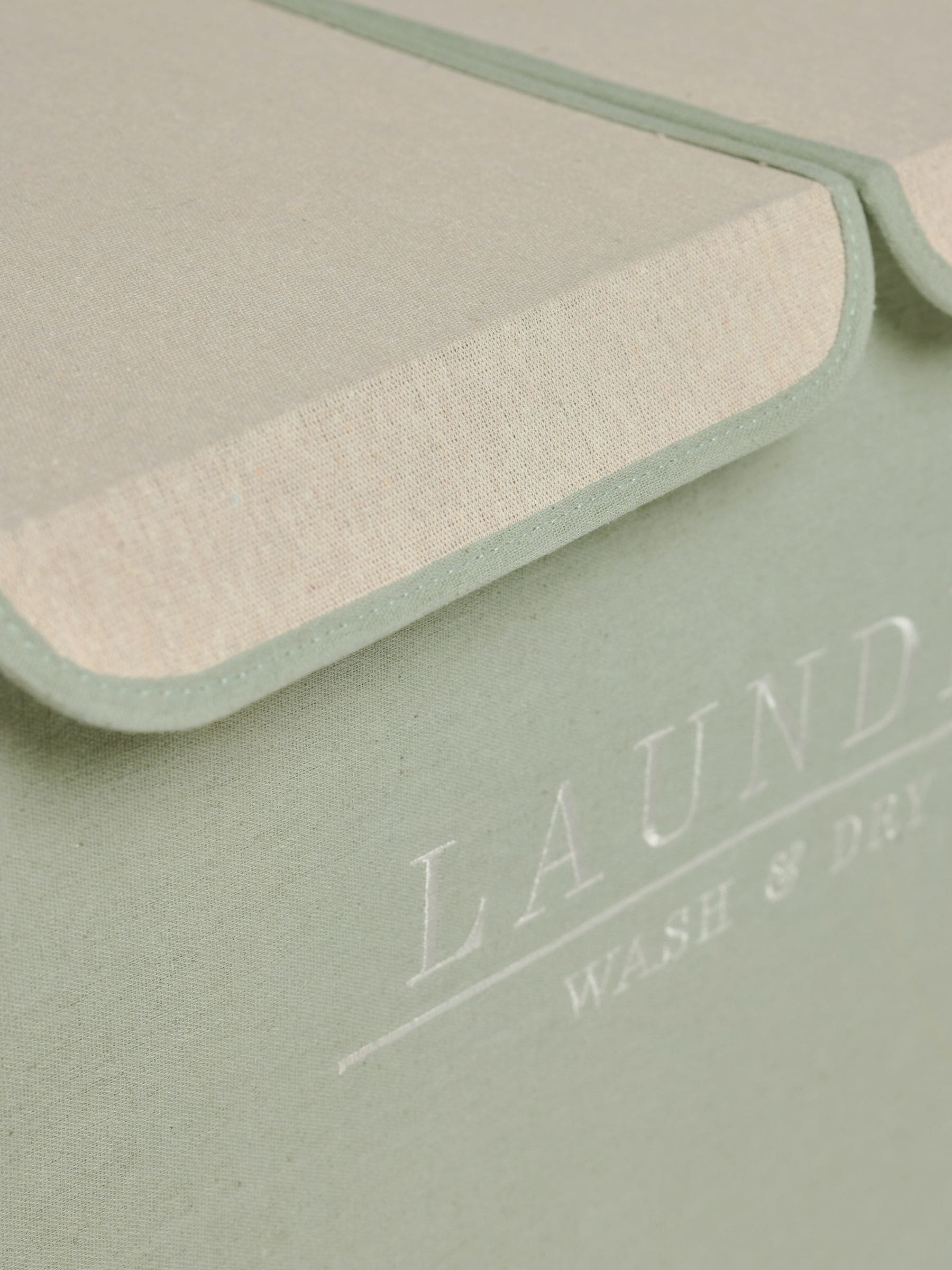 Sage green laundry sorter basket with embroidered detail - British product
