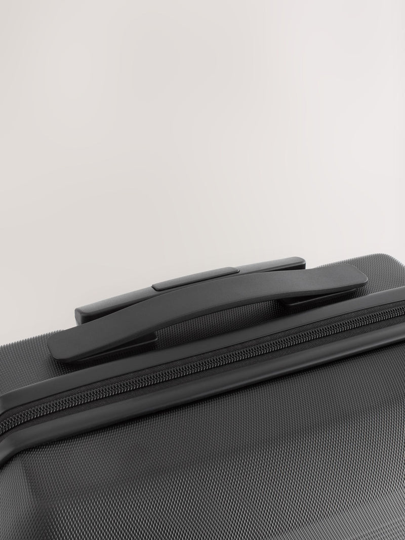 Black medium suitcase with ABS hard shell and TSA lock - British product