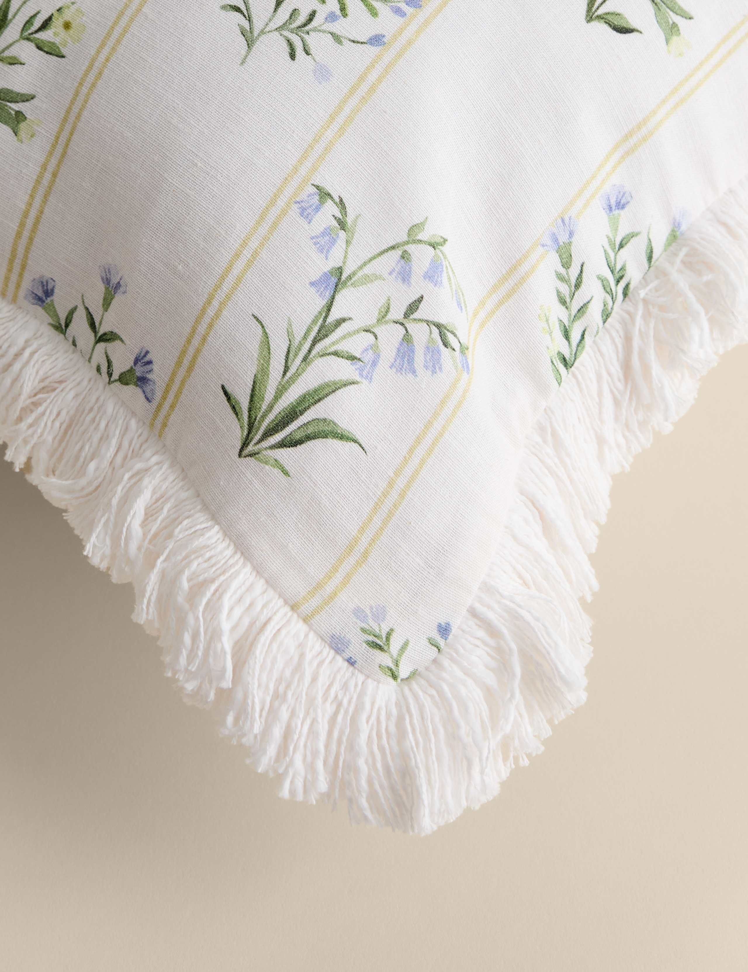 Cotton rich floral cushion with fringed edge, UK version