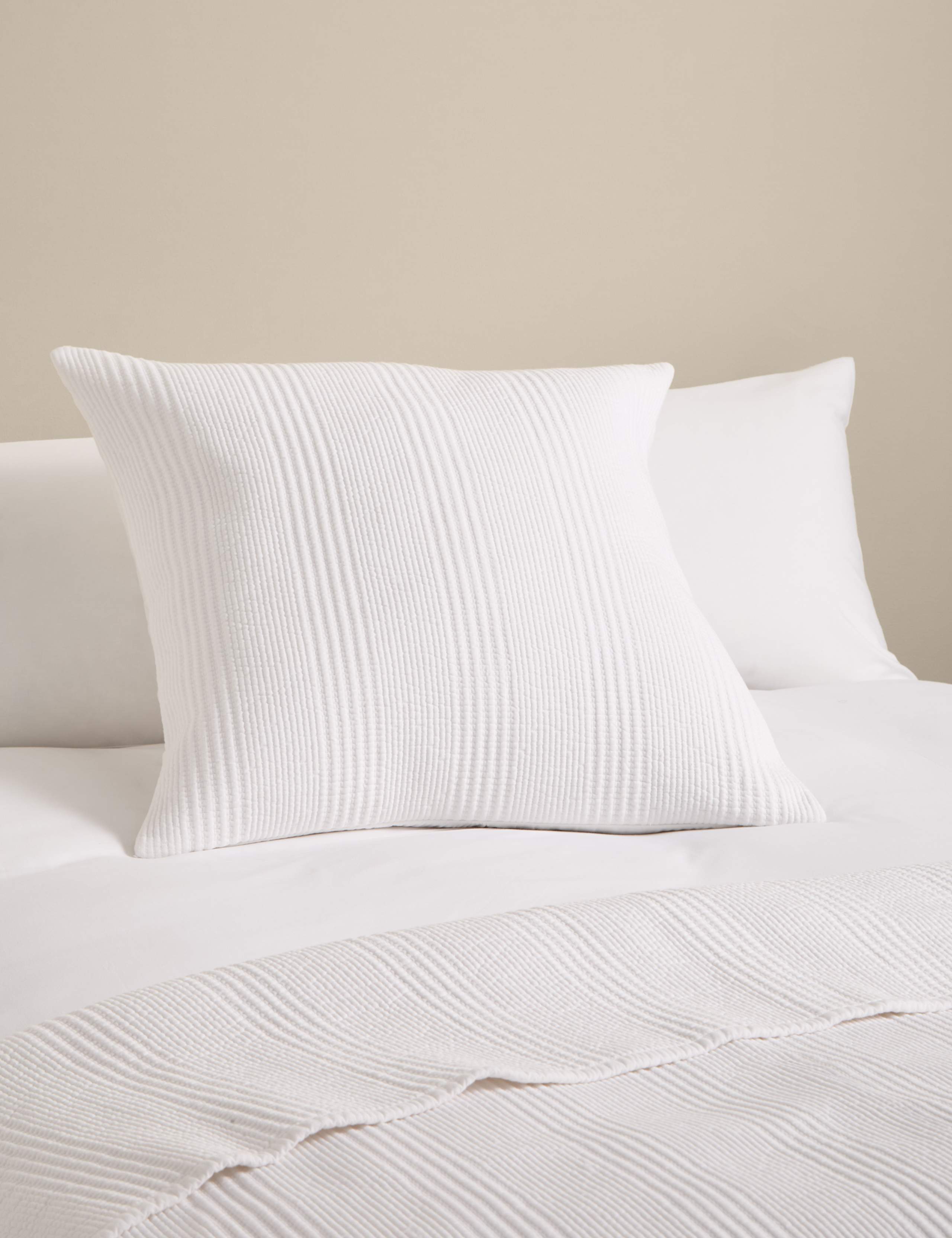 Decorative cushion with cotton rich fabric and striped design (British brand)
