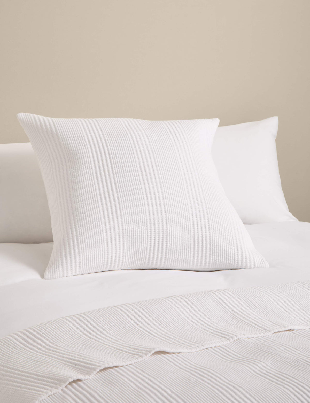 Decorative cushion with cotton rich fabric and striped design (British brand)