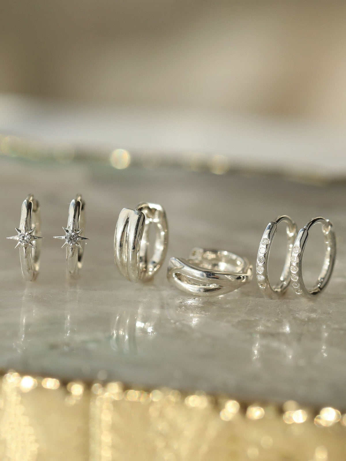 Carrie Elizabeth diamond mini hoop earrings (British brand)