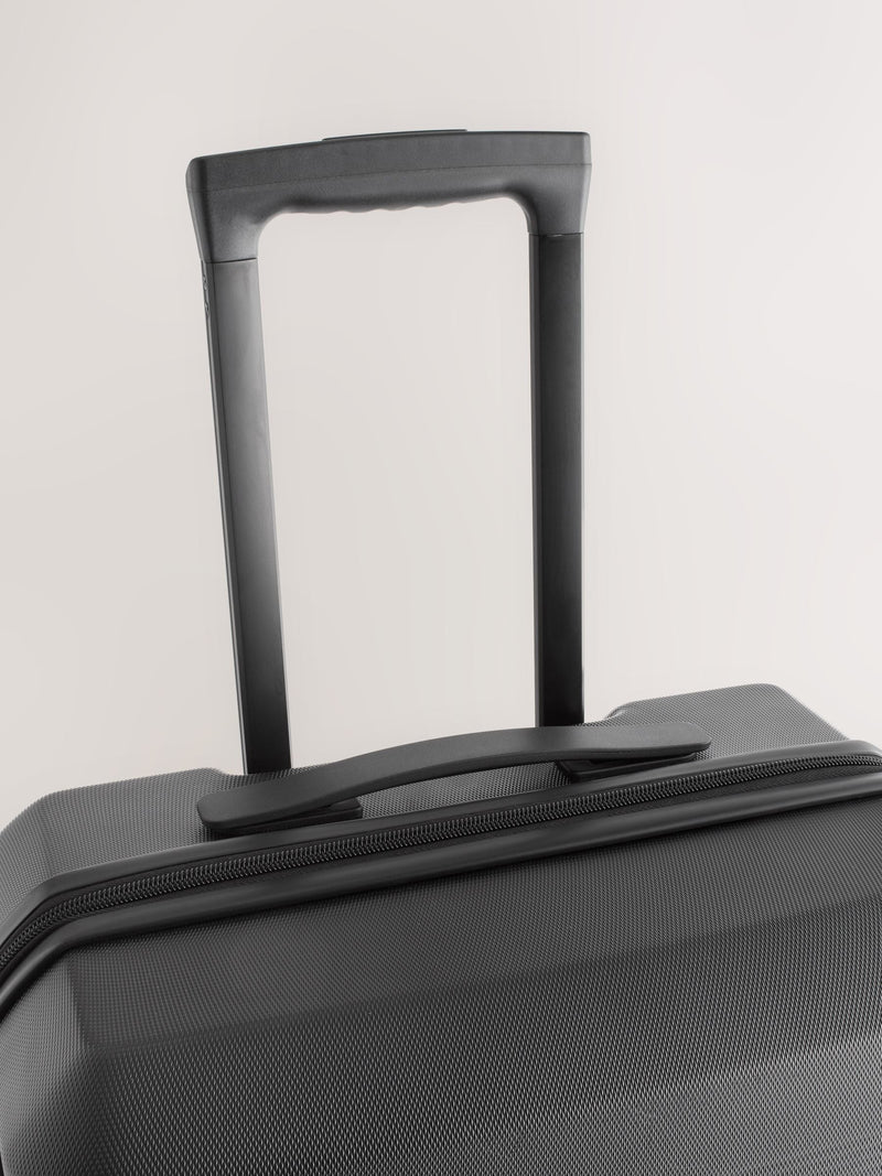 Black medium suitcase with ABS hard shell and TSA lock - British product