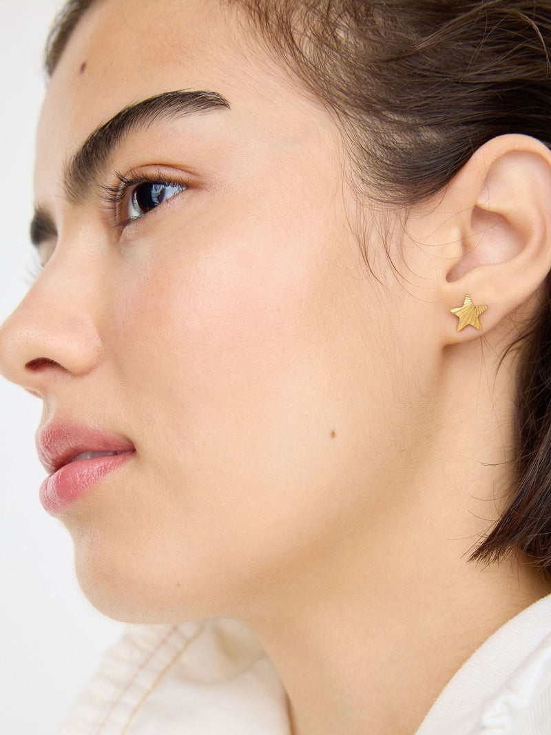 Oliver Bonas gold tone star stud earrings, imported from the UK