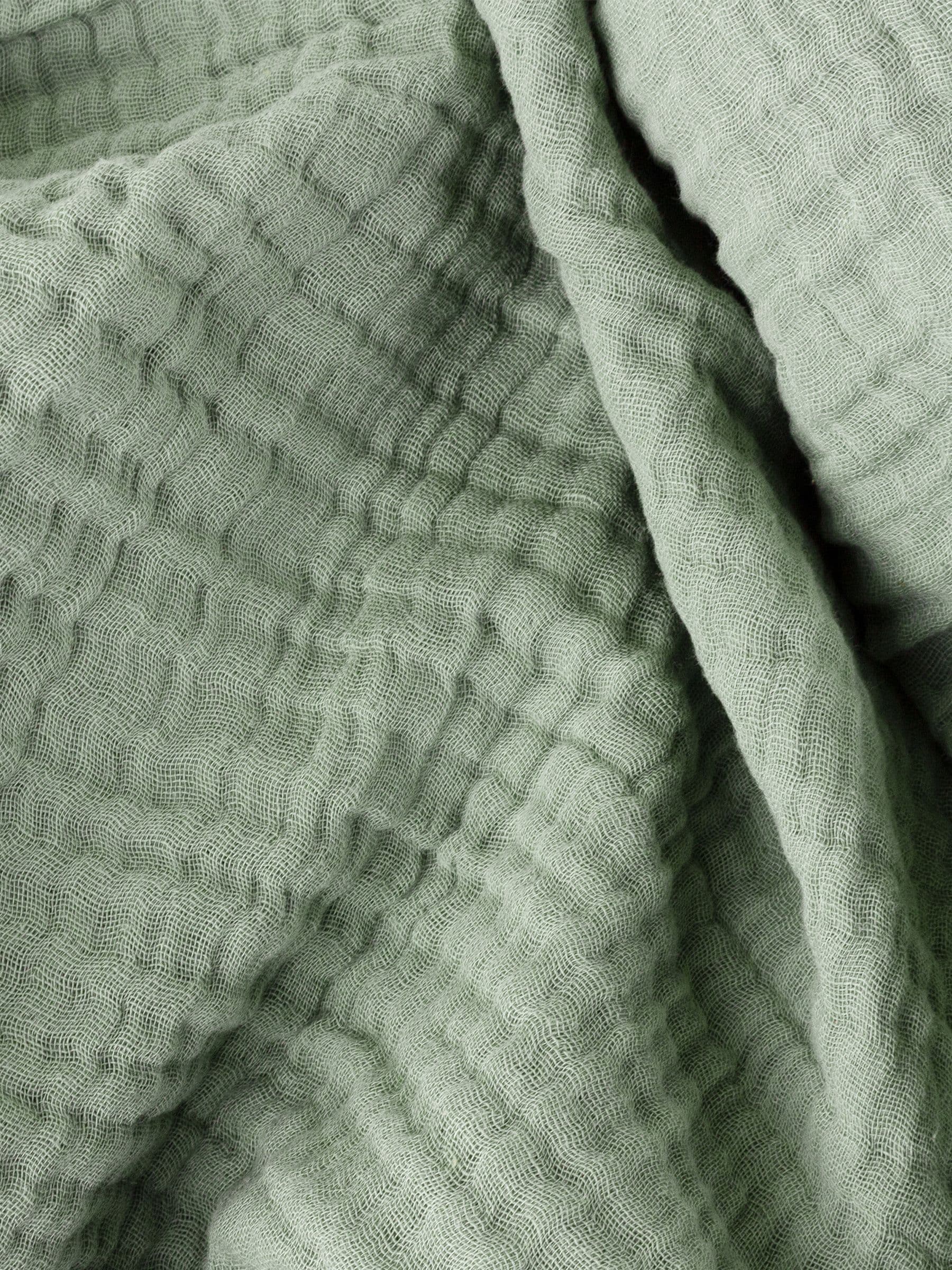 Lark muslin crinkle cotton throw in eucalyptus green (British brand)