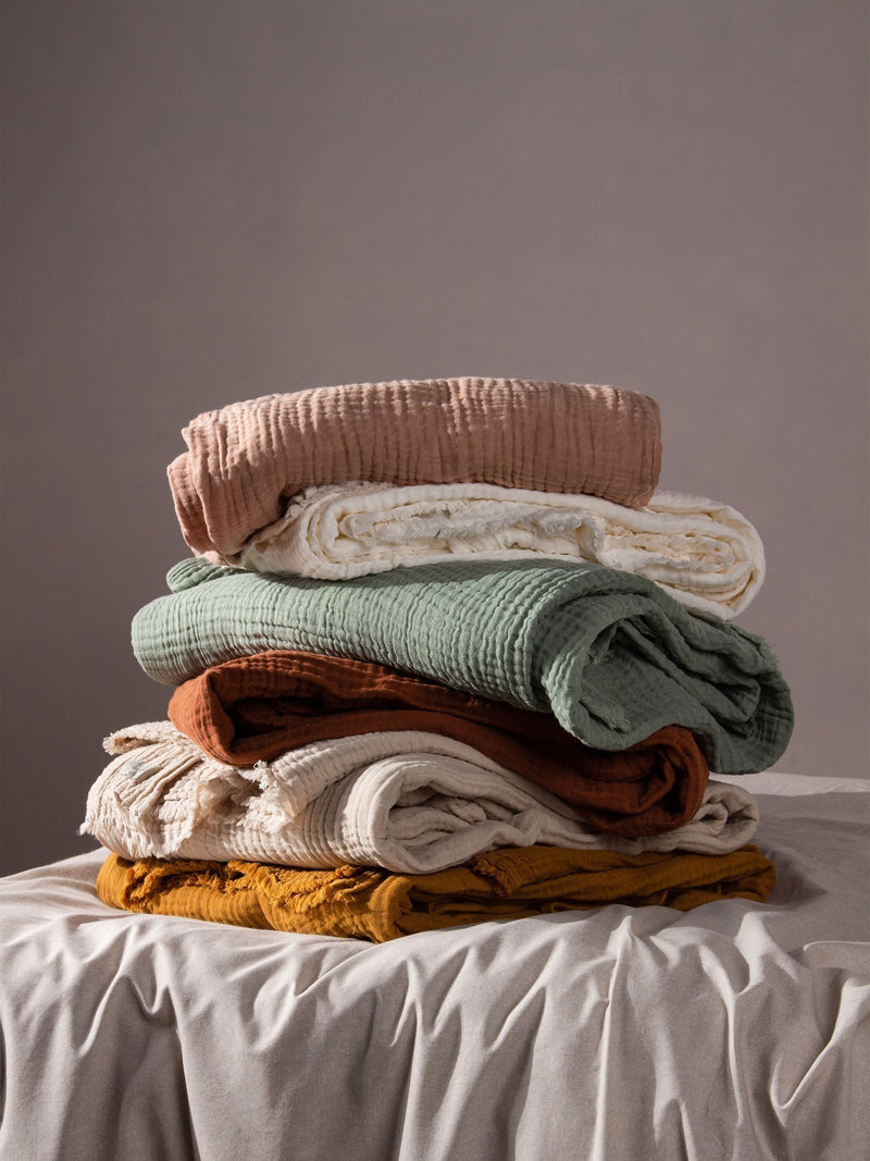 Lark muslin crinkle cotton throw in eucalyptus green (British brand)