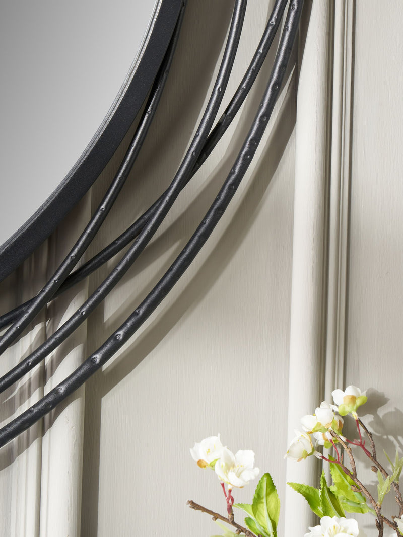 Pacific black metal swirl round wall mirror, imported from the UK