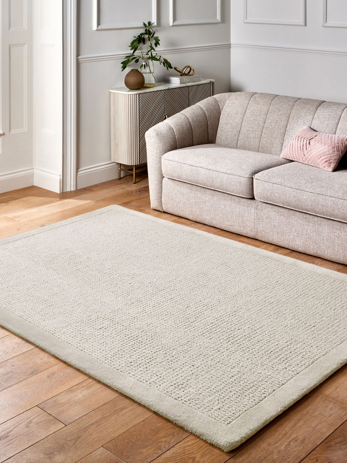 Lipsy natural border wool tufted rug, imported from the UK