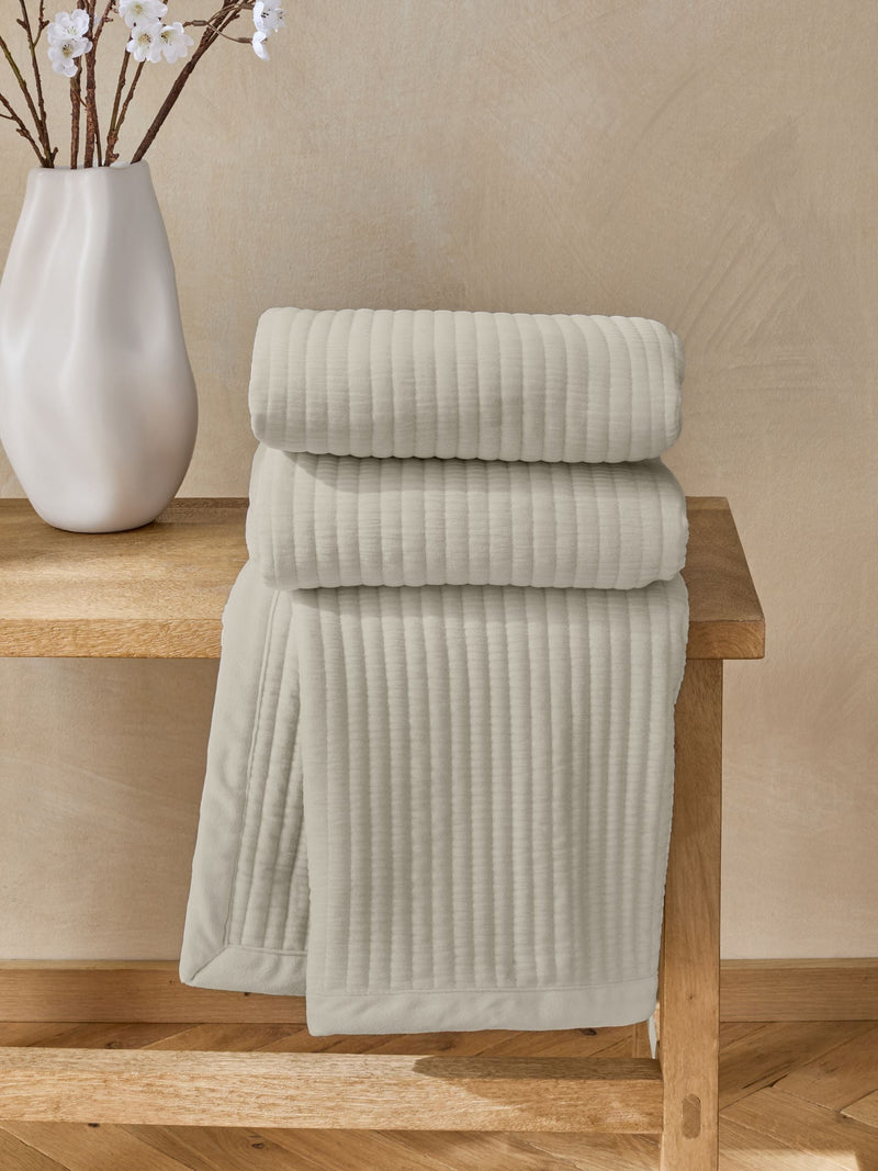 Natural Carrie quilted velvet bedspread, imported from the UK