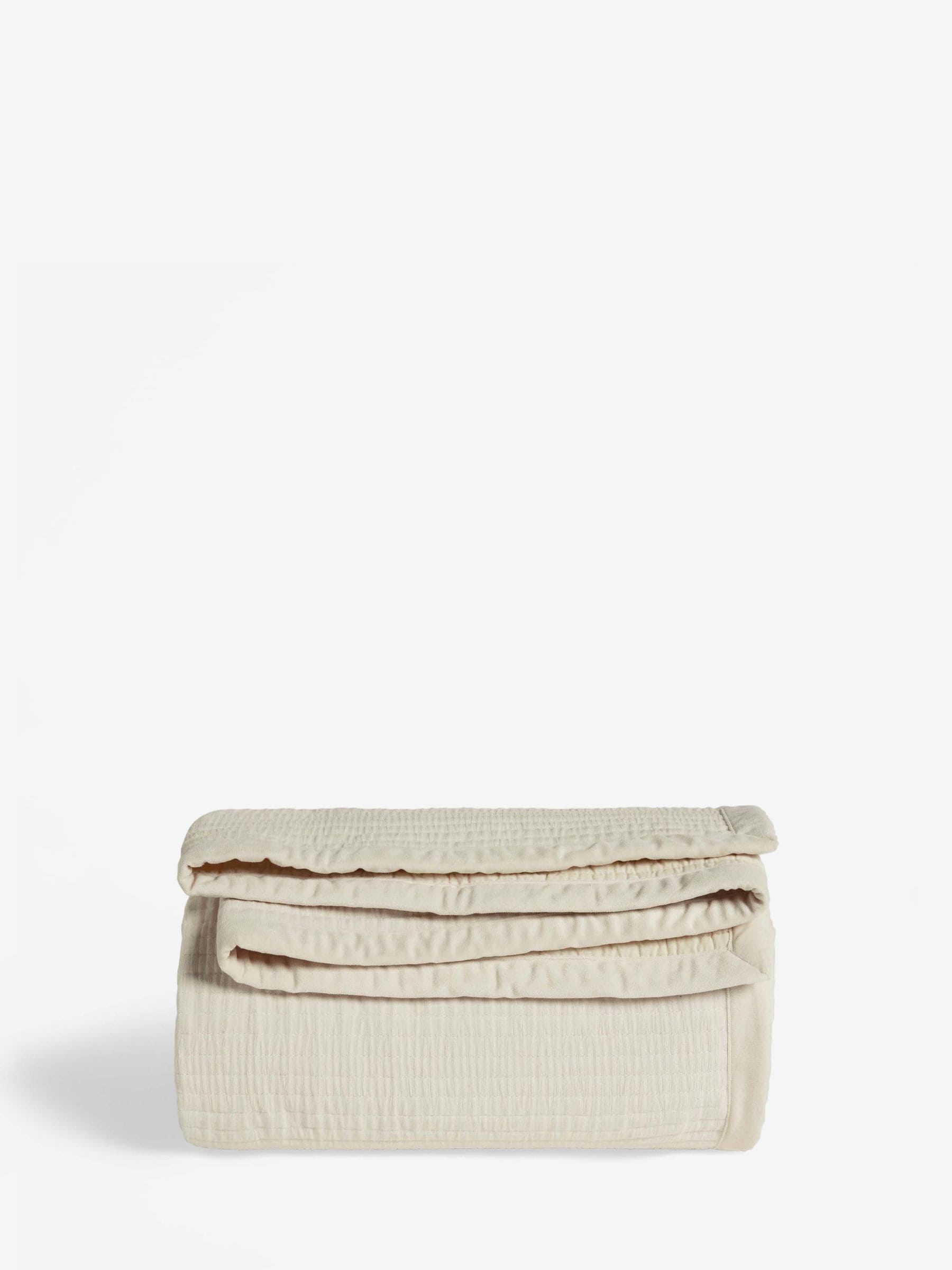 Natural Carrie quilted velvet bedspread, imported from the UK