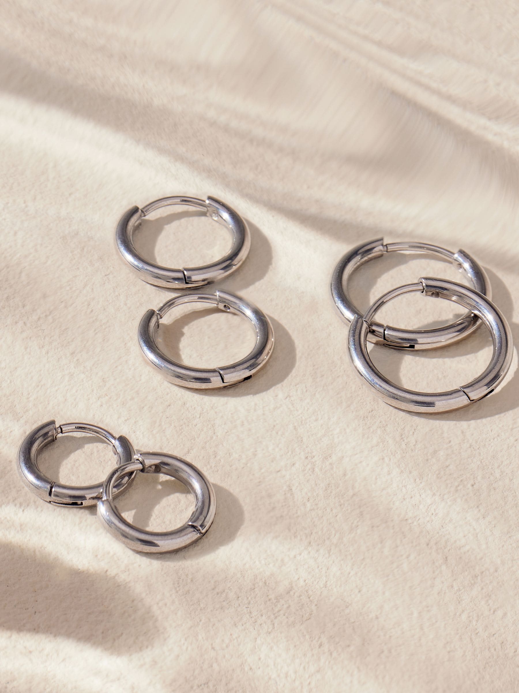 Stainless steel graduated huggie hoop earrings 3 pack (British brand)