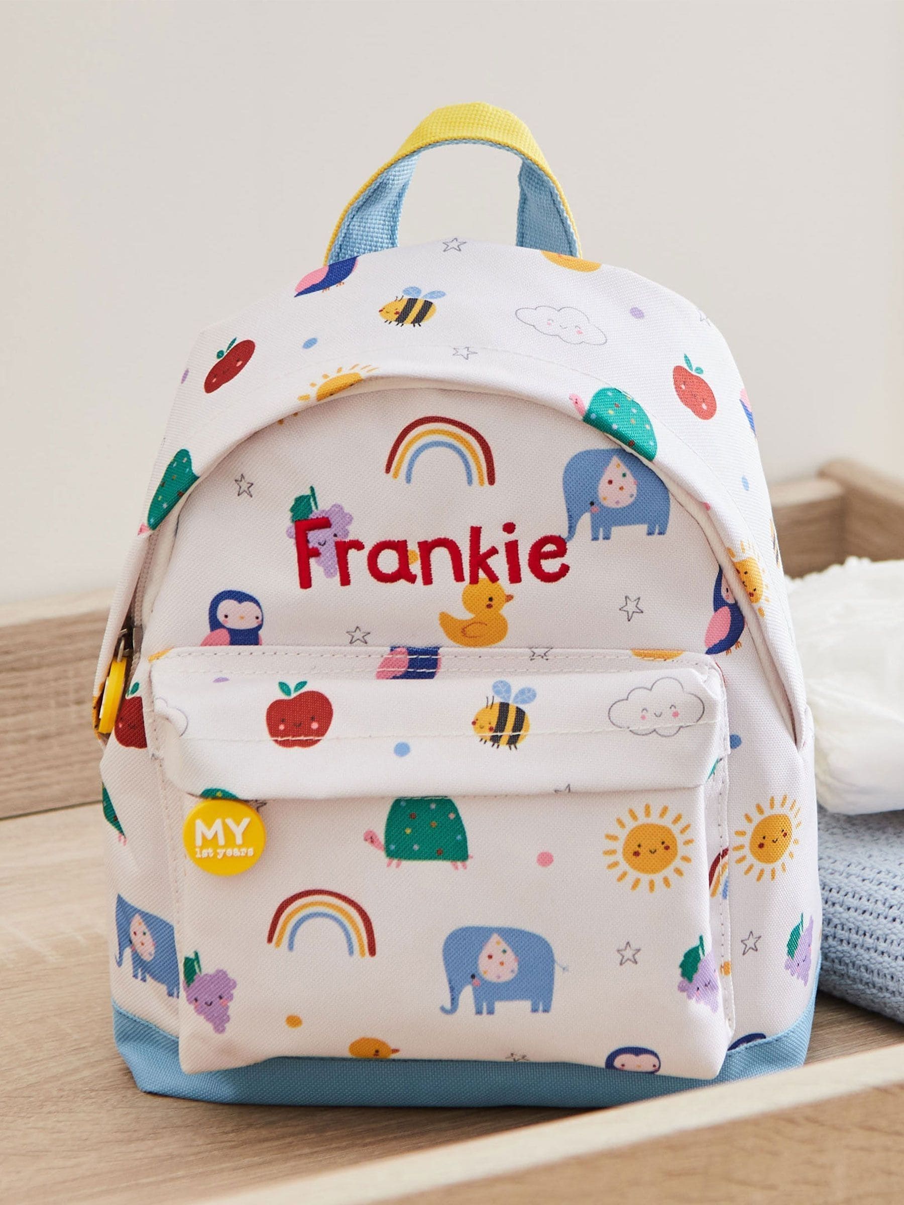 My 1st Years personalised colourful print mini backpack, imported from the UK