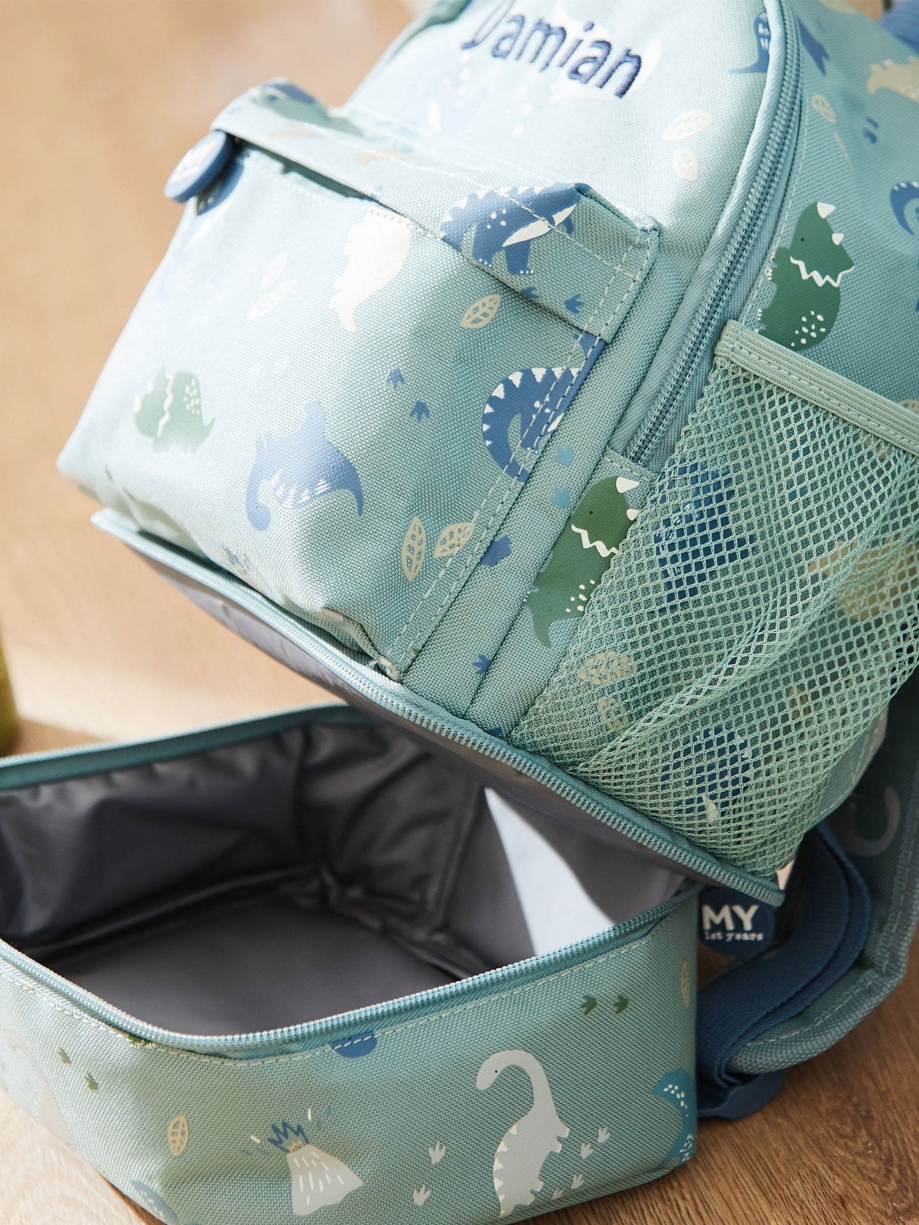 My 1st Years personalised green dinosaur print mini backpack, UK version