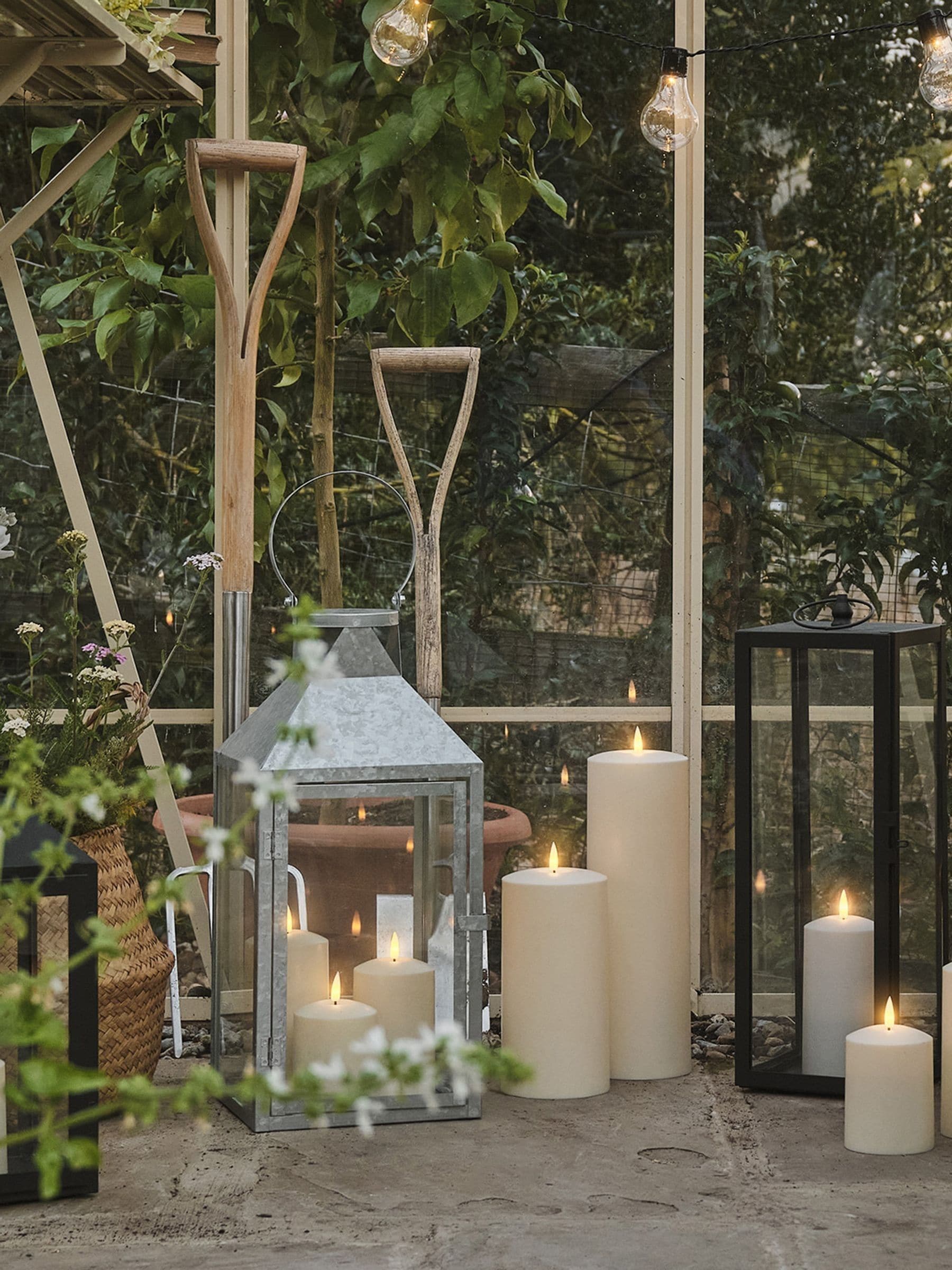 Lights4fun black outdoor metal lantern with TruGlow candle, imported from the UK