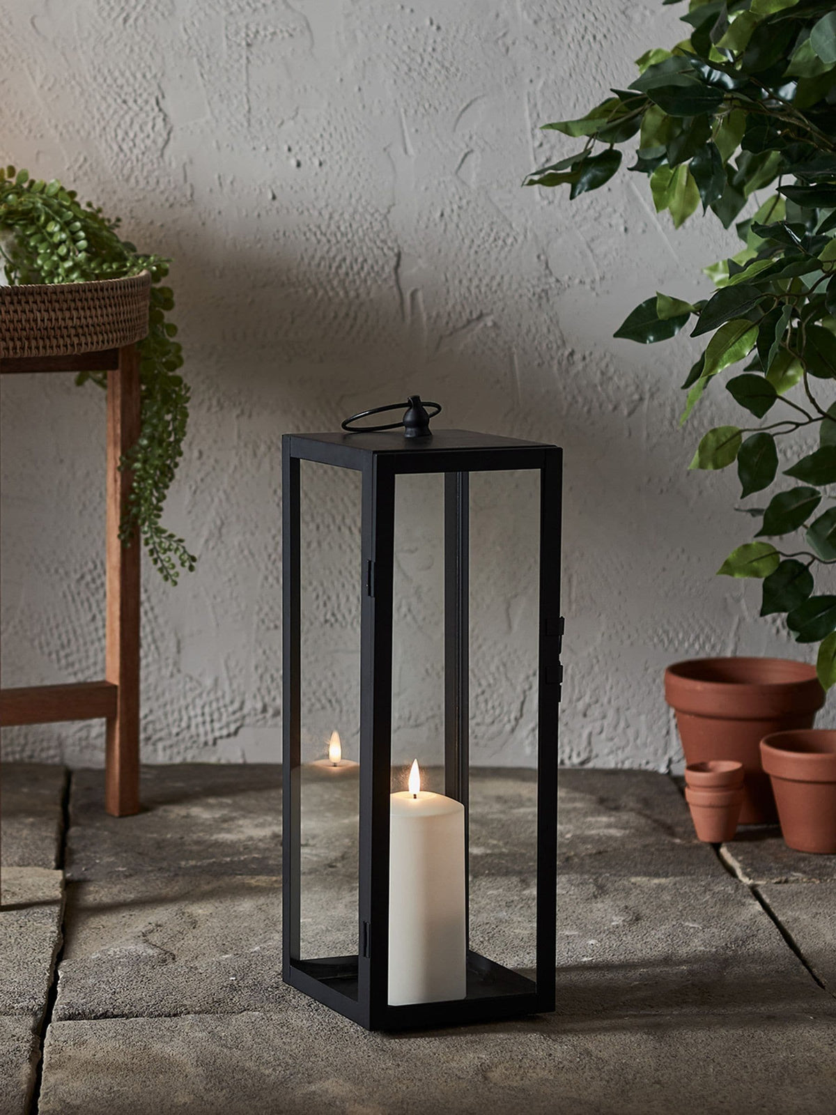 Lights4fun black outdoor metal lantern with TruGlow candle, imported from the UK