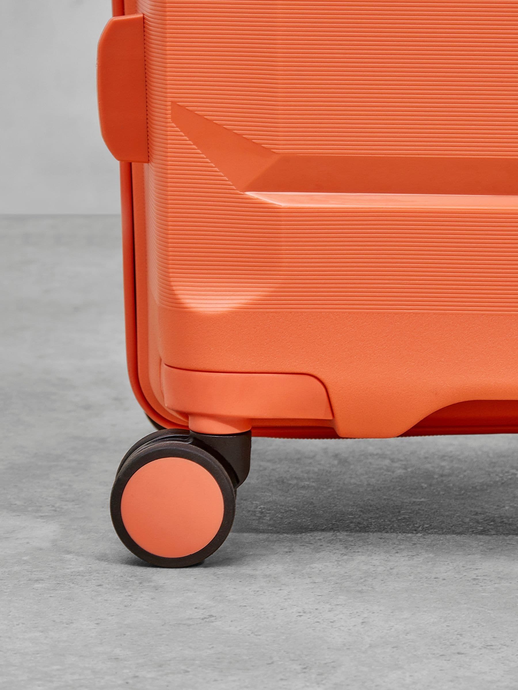 Rock Tulum medium suitcase in orange, imported from the UK