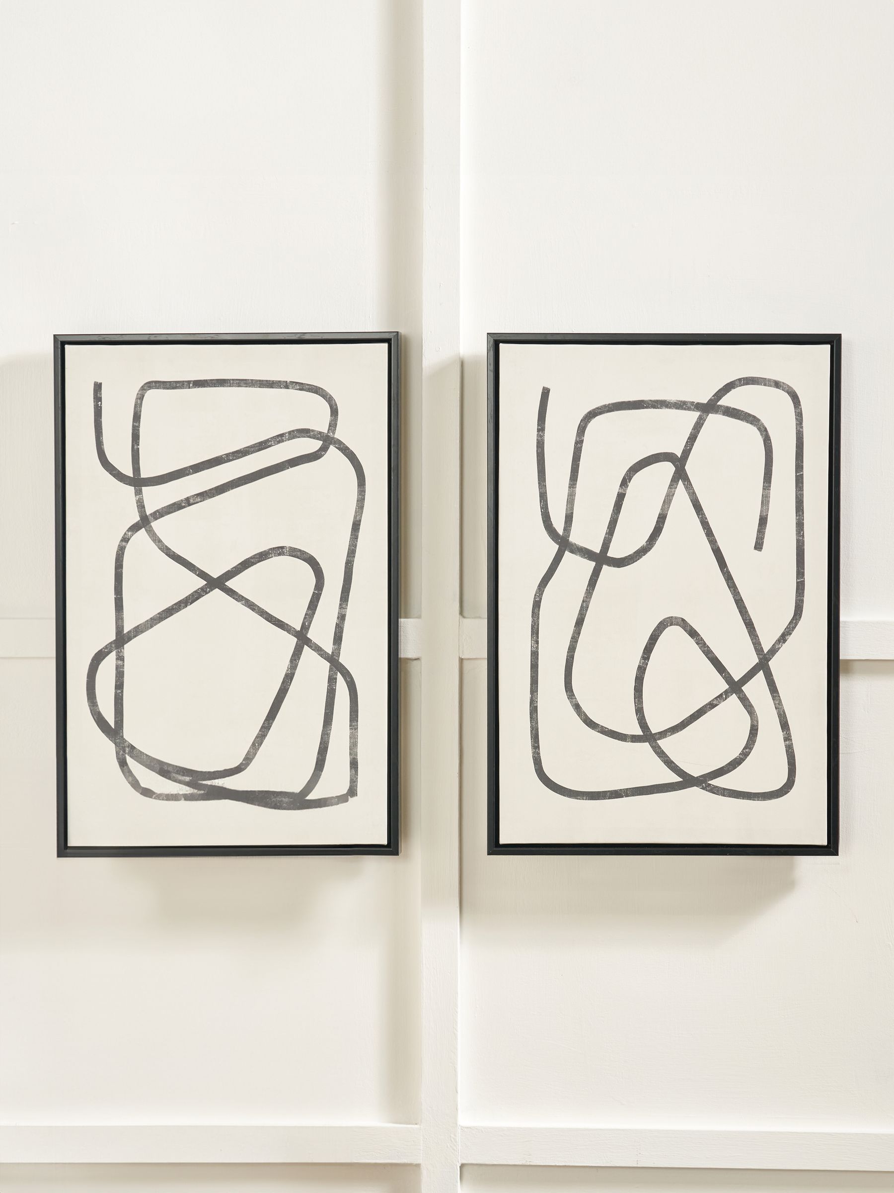 Black and white squiggle print canvases with frames, imported from the UK