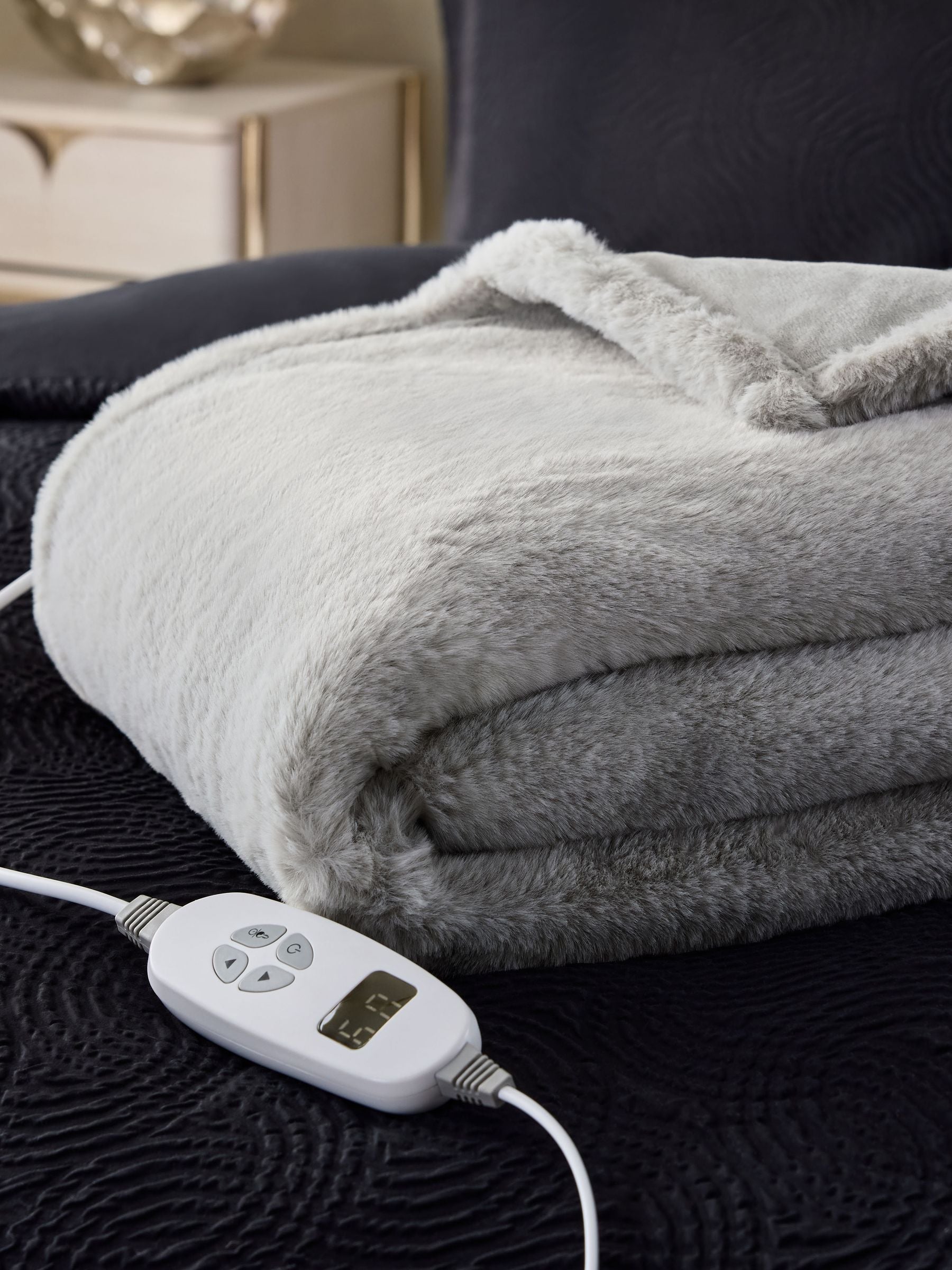 Grey plush electric heated faux fur throw, imported from the UK