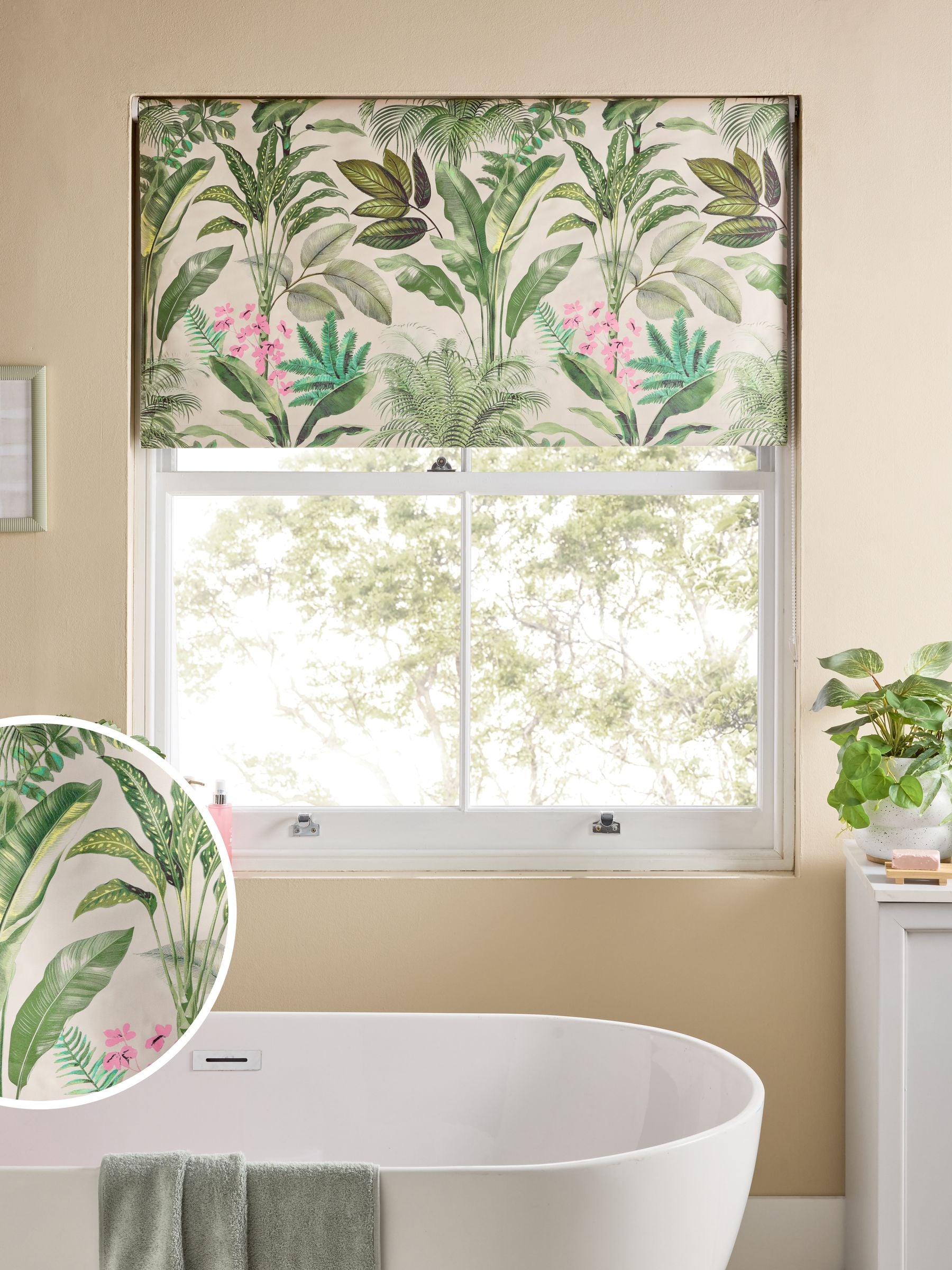 Tropical leaf print blackout roller blind in green and pink, UK version