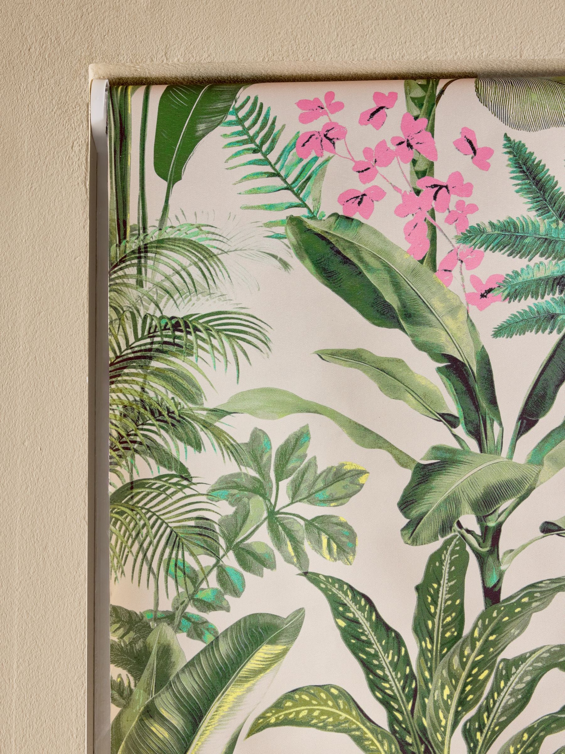 Tropical leaf print blackout roller blind in green and pink, UK version