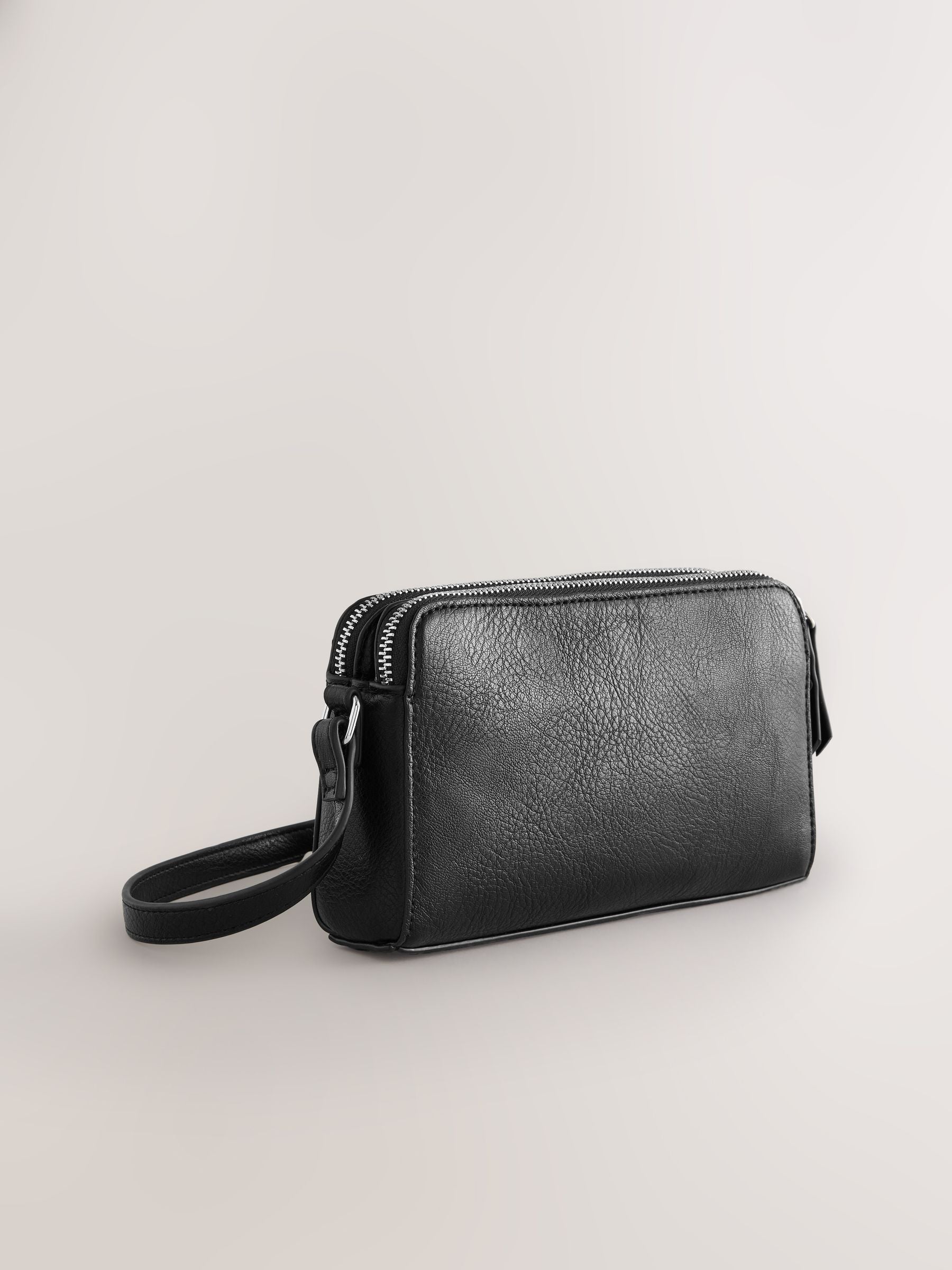 Black double zip cross body bag with adjustable strap, imported from the UK