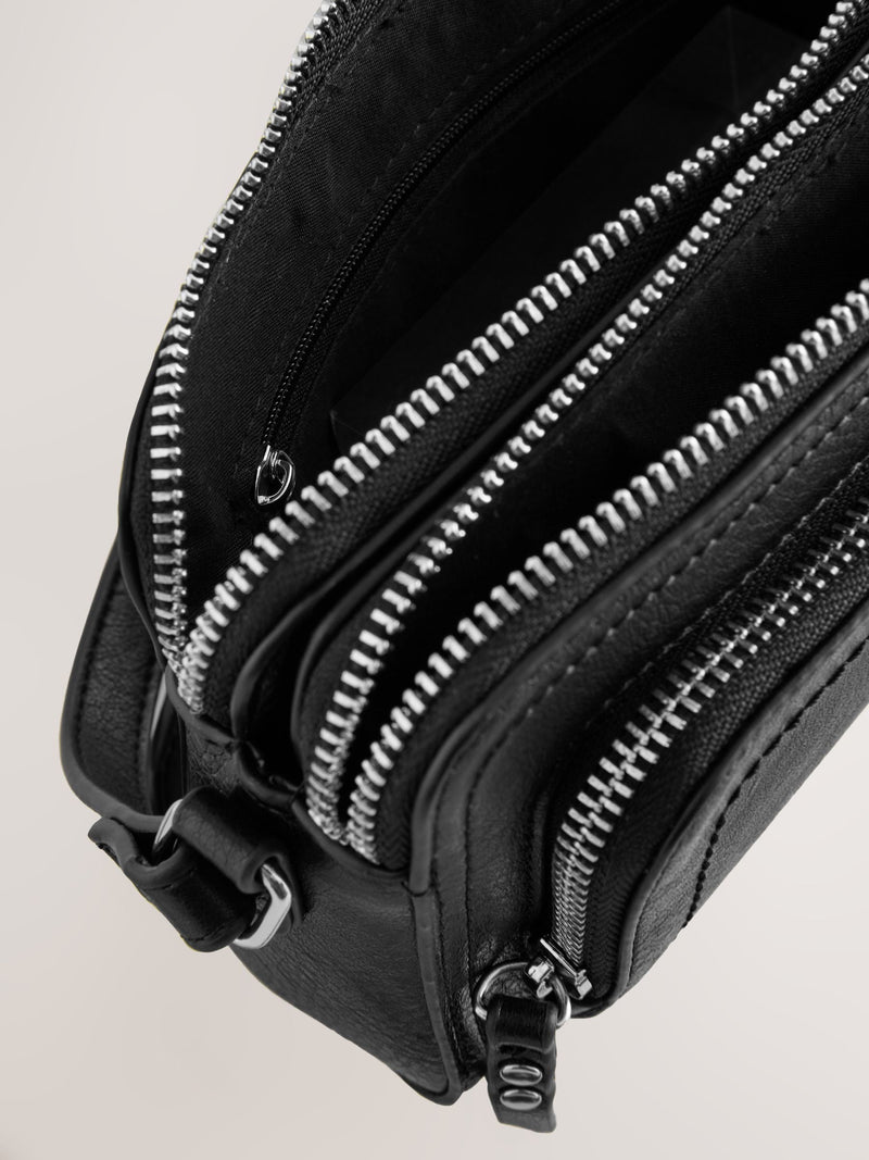 Black double zip cross body bag with adjustable strap, imported from the UK