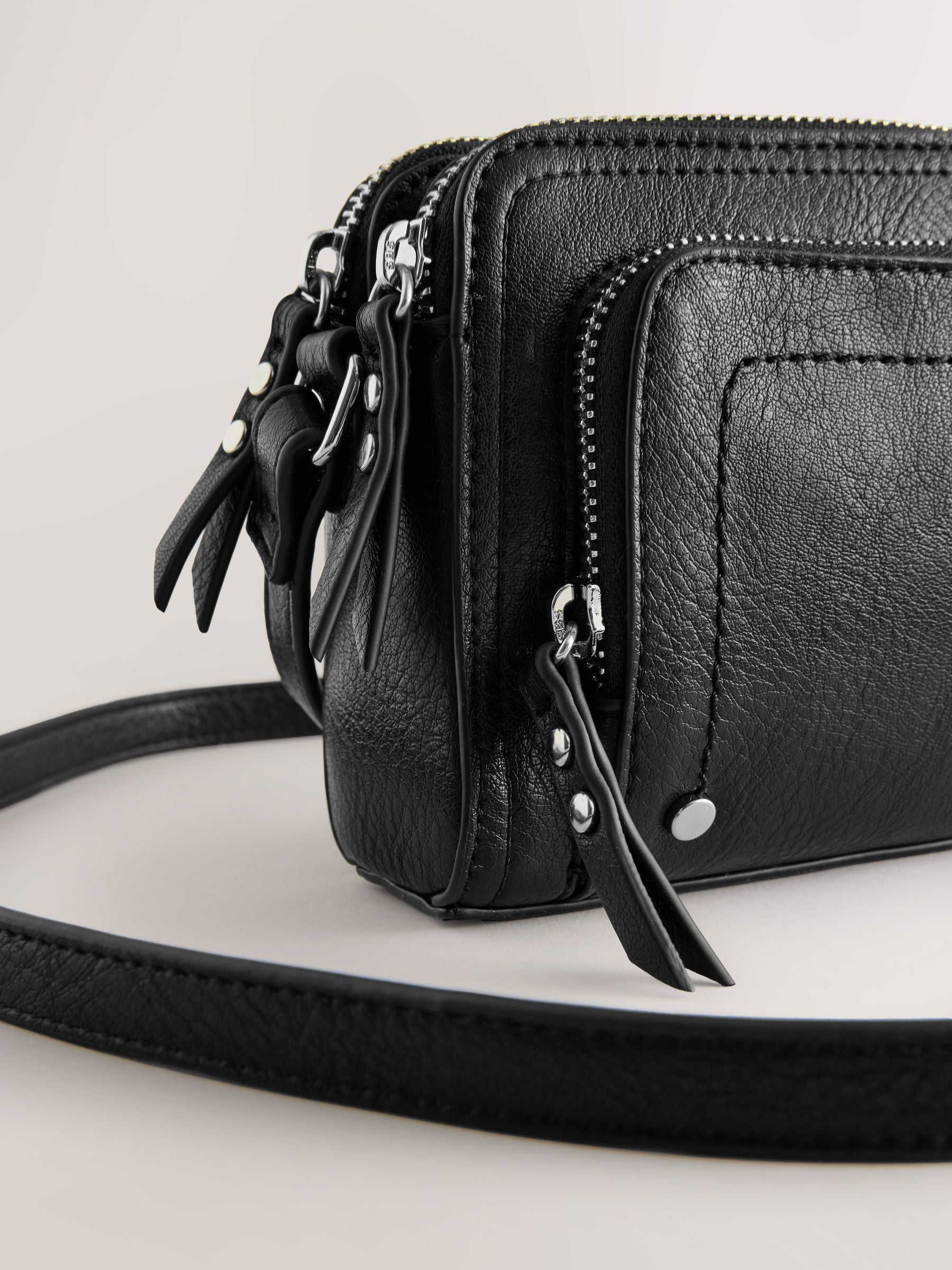 Black double zip cross body bag with adjustable strap, imported from the UK