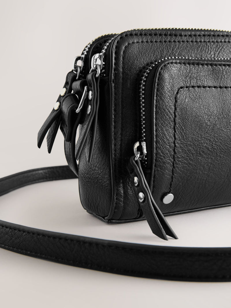Black double zip cross body bag with adjustable strap, imported from the UK