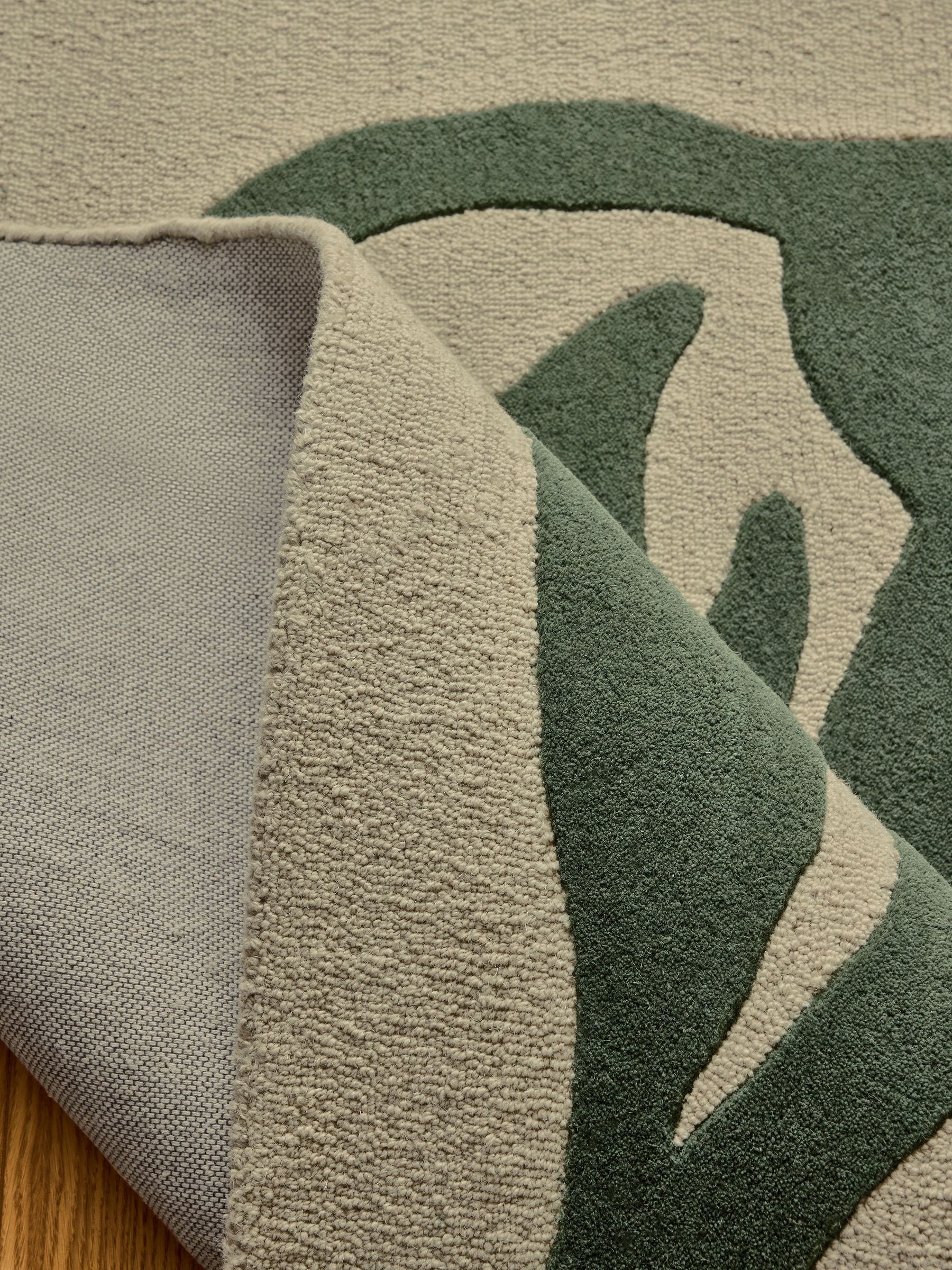 French Connection green abstract leaf wool tufted rug, imported from the UK
