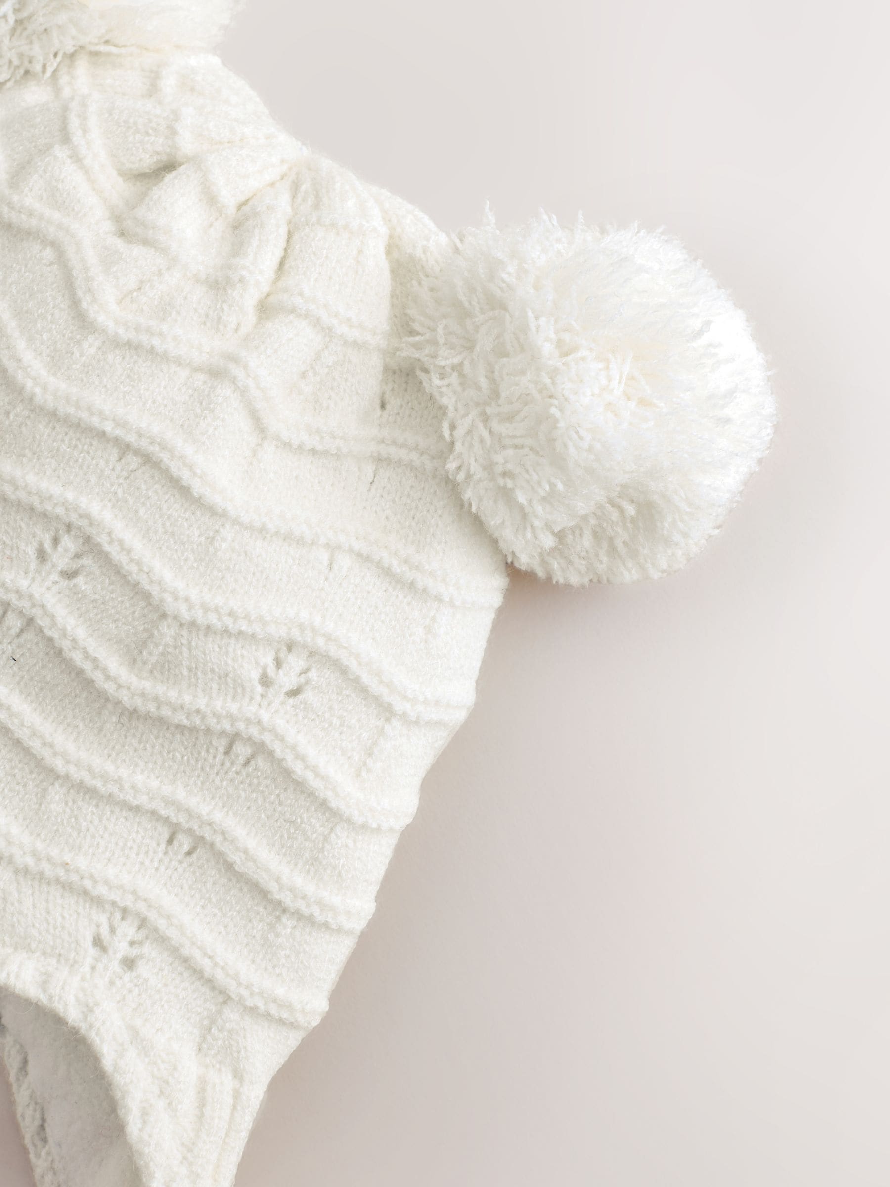 White knitted baby trapper hat double pom, imported from the UK