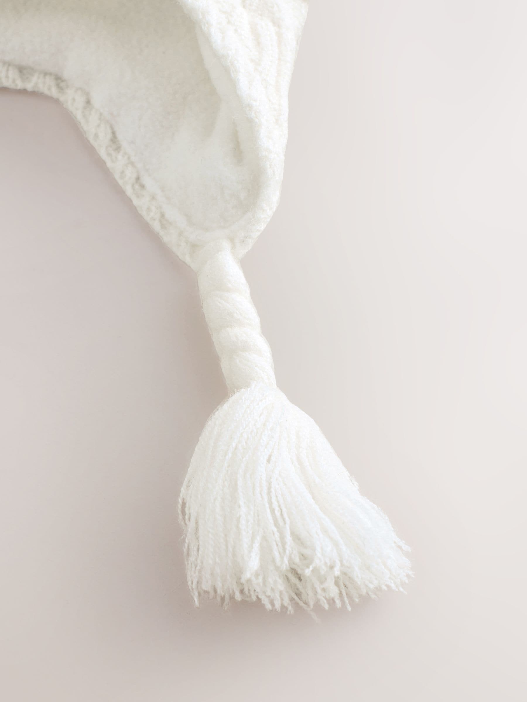 White knitted baby trapper hat double pom, imported from the UK