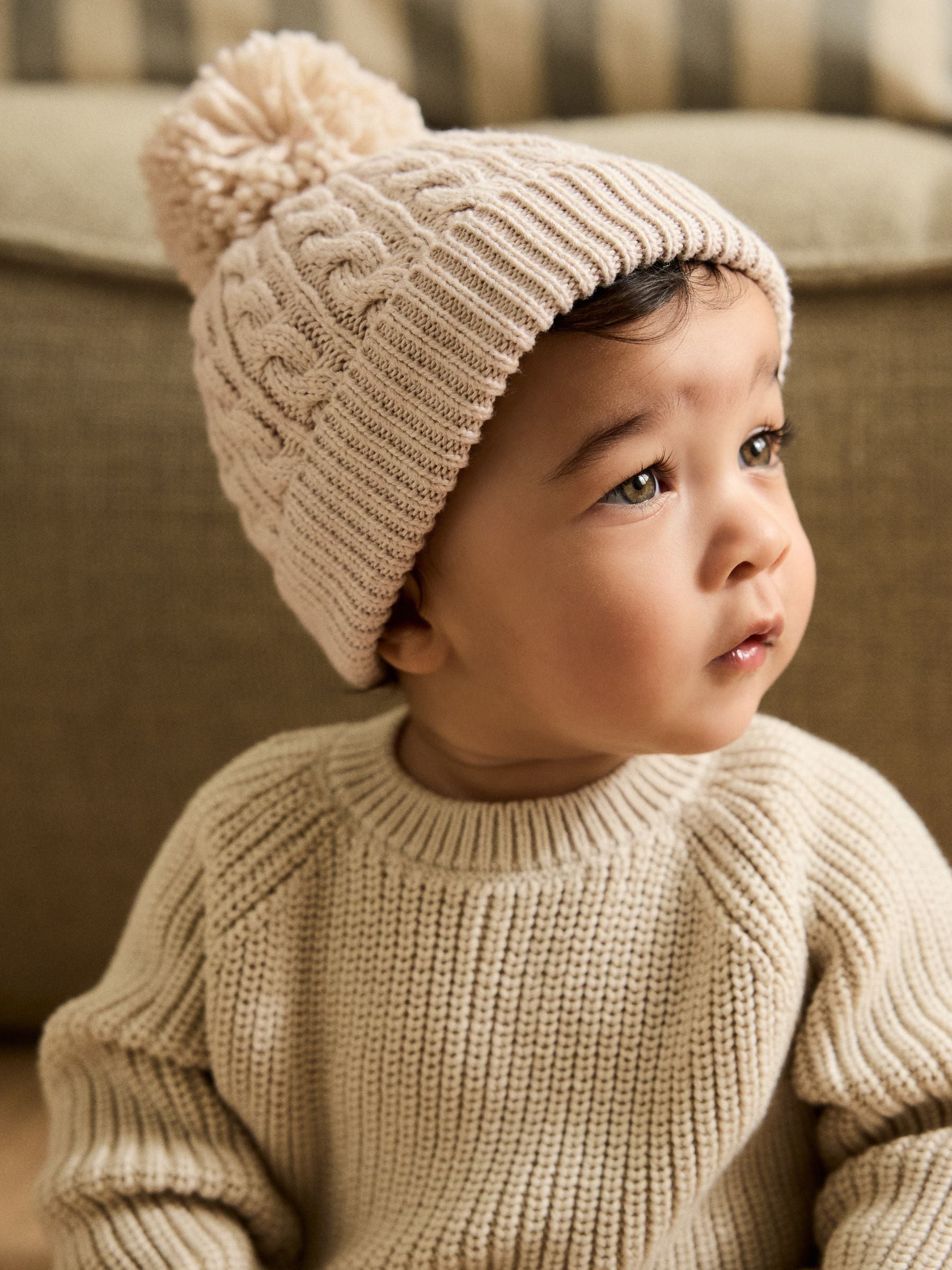 Cream knitted cable pom beanie, UK version