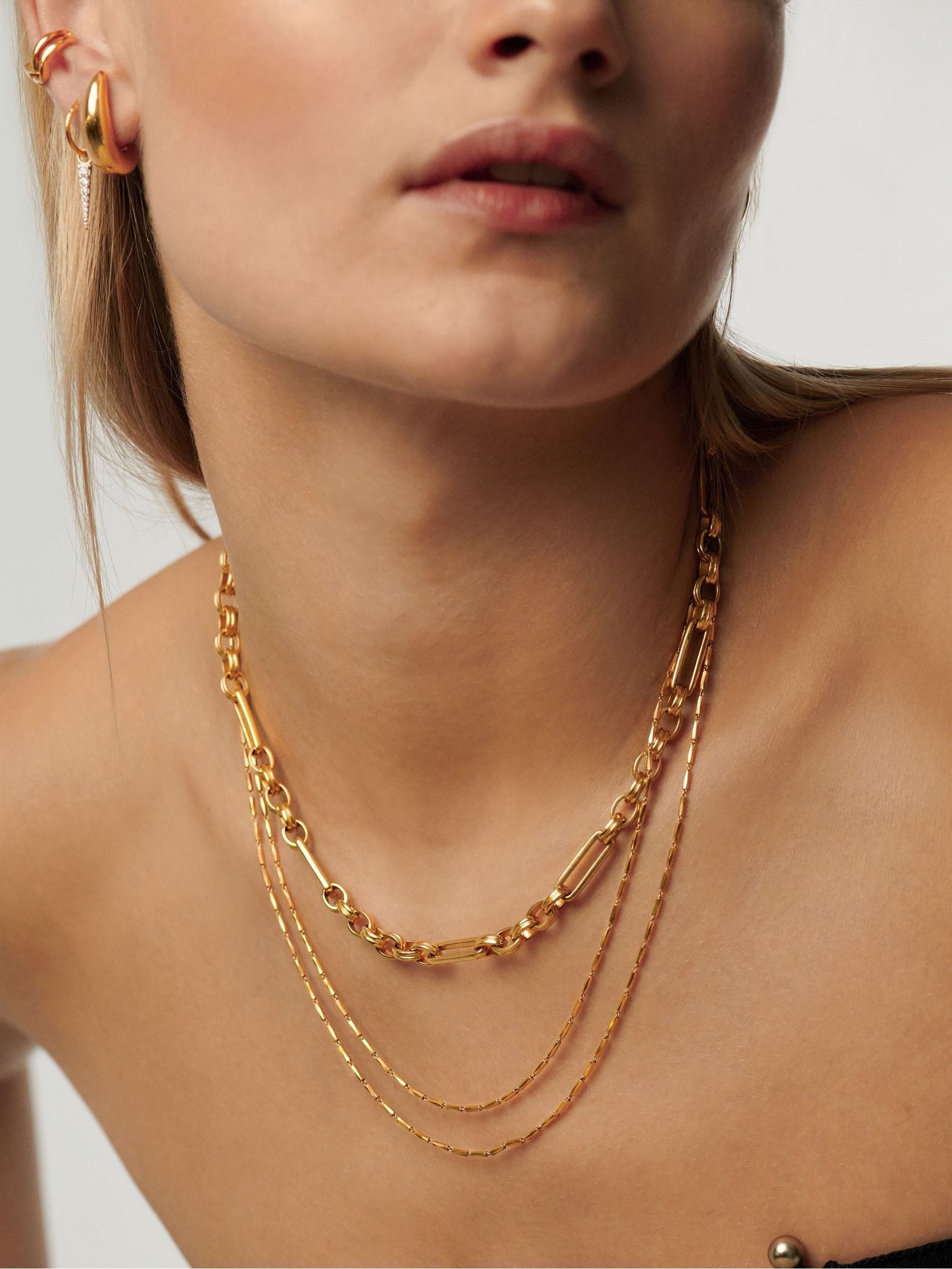 Missoma gold tone axiom chain necklace, imported from the UK