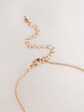 Gold tone mother of pearl octagon necklace, UK version