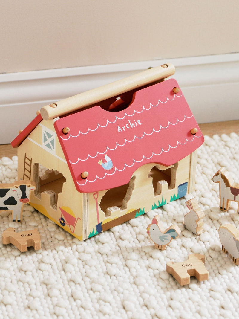 My 1st Years personalised wooden farmhouse shape sorter, imported from the UK