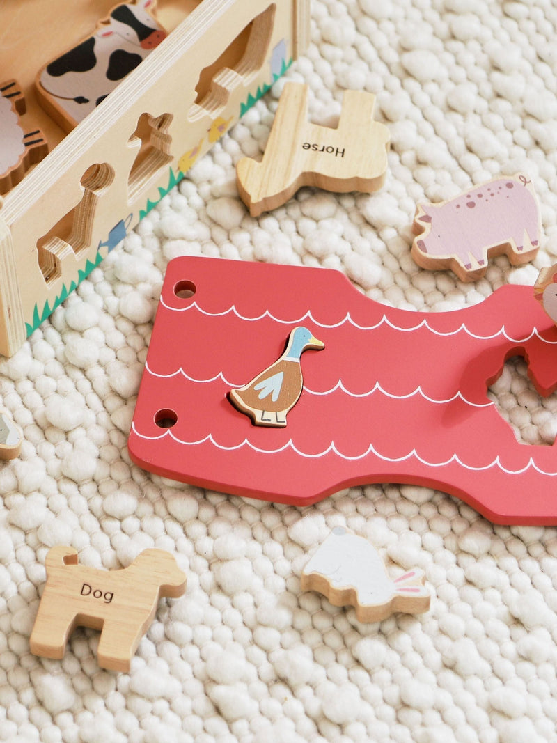 My 1st Years personalised wooden farmhouse shape sorter, imported from the UK