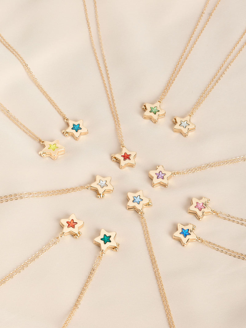 Gold tone star locket with birthstone detail - British product
