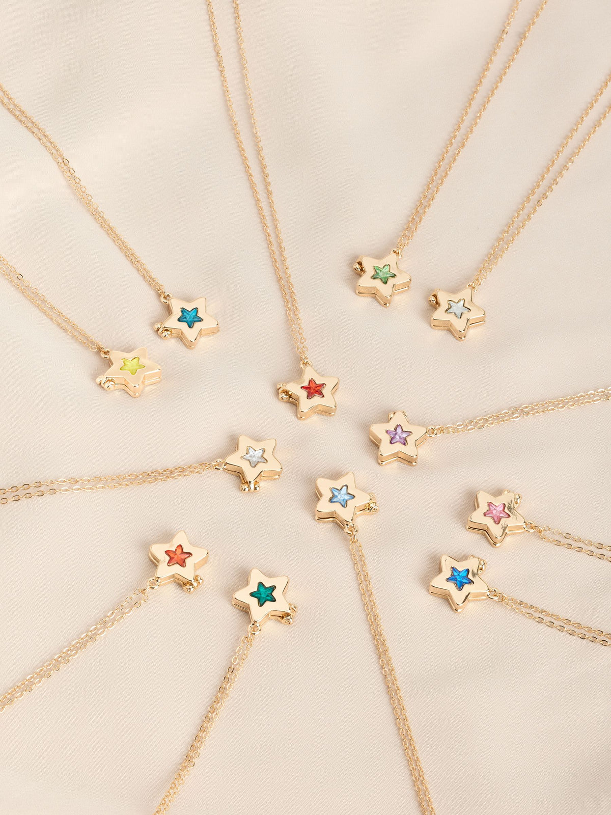 Gold tone star locket with birthstone detail - British product