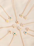 Gold tone star locket with birthstone detail - British product