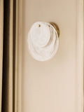 White Claremont wall light with brushed brass and opaque glass discs, imported from the UK